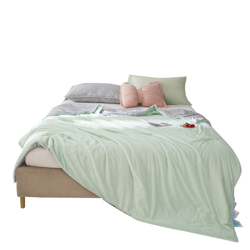 VILZSTUDIOS pastel two-tone summer quilt with circular quilting and piped edges