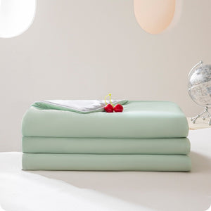 VILZSTUDIOS pastel two-tone summer quilt with circular quilting and piped edges