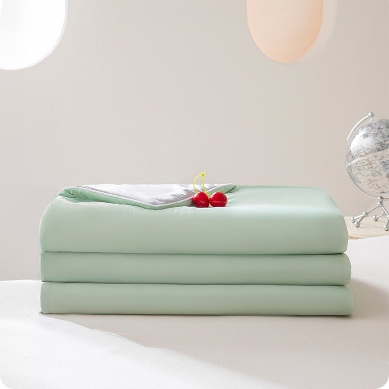 VILZSTUDIOS pastel two-tone summer quilt with circular quilting and piped edges