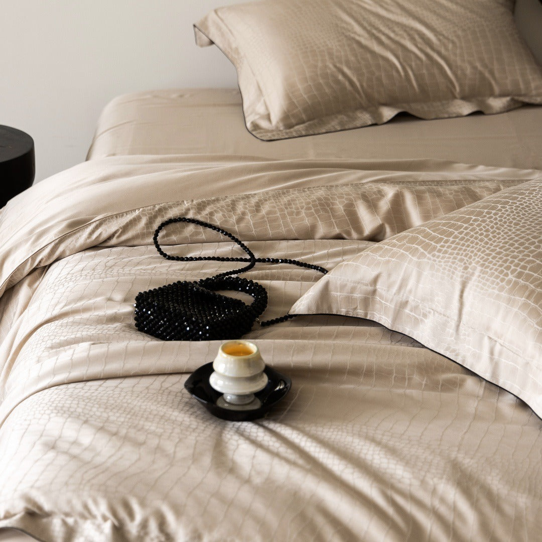 VILZSTUDIOS neutral satin jacquard duvet cover set with wide pillowcase borders and dark contrast piping