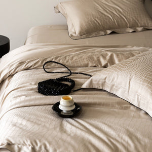 VILZSTUDIOS neutral satin jacquard duvet cover set with wide pillowcase borders and dark contrast piping