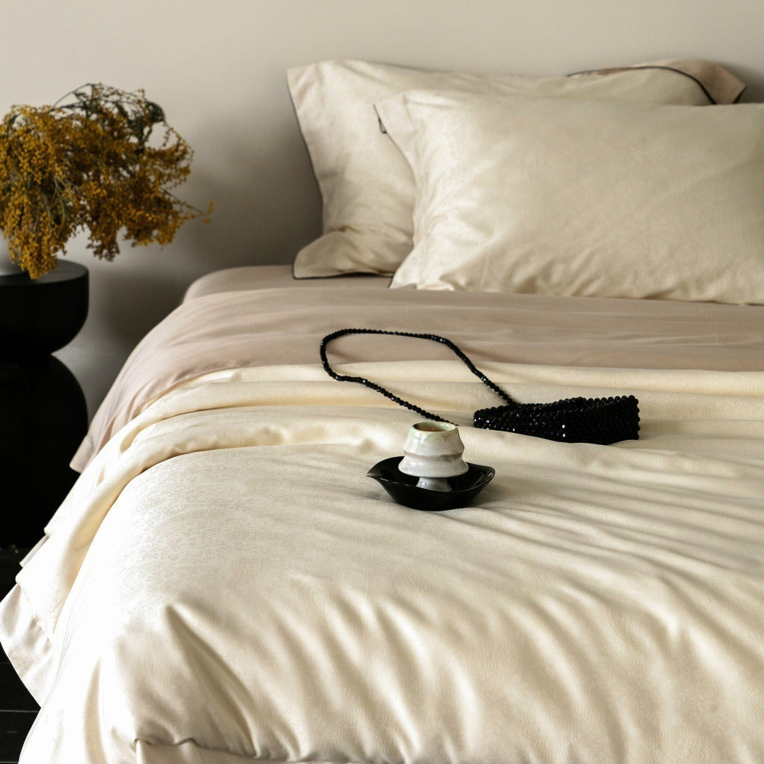 VILZSTUDIOS neutral satin jacquard duvet cover set with wide pillowcase borders and dark contrast piping