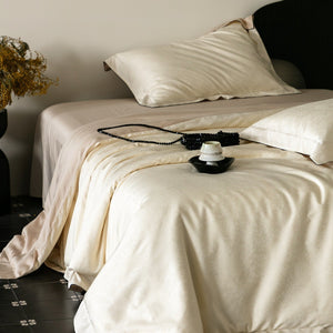 VILZSTUDIOS neutral satin jacquard duvet cover set with wide pillowcase borders and dark contrast piping