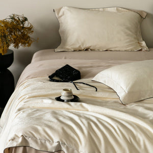 VILZSTUDIOS neutral satin jacquard duvet cover set with wide pillowcase borders and dark contrast piping