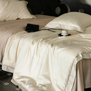 VILZSTUDIOS neutral satin jacquard duvet cover set with wide pillowcase borders and dark contrast piping