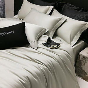 VILZSTUDIOS muted solid-color satin duvet cover set with piped borders and flanged pillowcases
