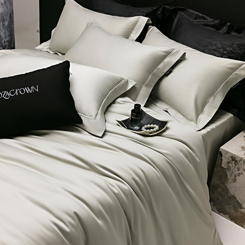 VILZSTUDIOS muted solid-color satin duvet cover set with piped borders and flanged pillowcases