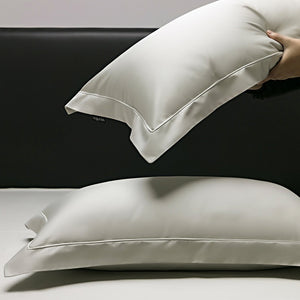 VILZSTUDIOS muted solid-color satin duvet cover set with piped borders and flanged pillowcases