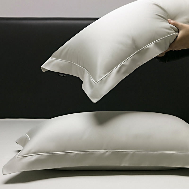 VILZSTUDIOS muted solid-color satin duvet cover set with piped borders and flanged pillowcases