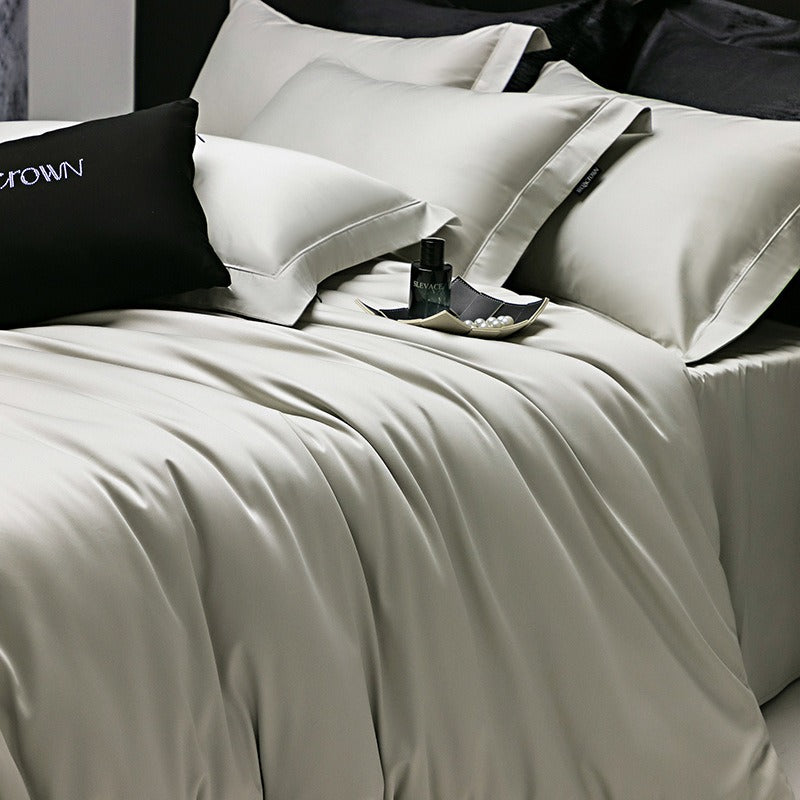 VILZSTUDIOS muted solid-color satin duvet cover set with piped borders and flanged pillowcases