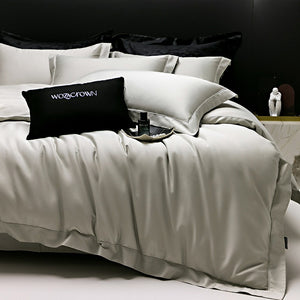 VILZSTUDIOS muted solid-color satin duvet cover set with piped borders and flanged pillowcases