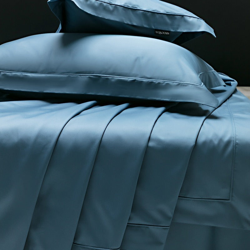 VILZSTUDIOS muted solid-color satin duvet cover set with piped borders and flanged pillowcases