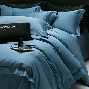 VILZSTUDIOS muted solid-color satin duvet cover set with piped borders and flanged pillowcases