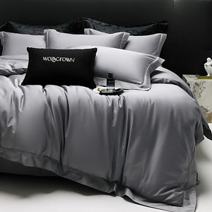 VILZSTUDIOS muted solid-color satin duvet cover set with piped borders and flanged pillowcases