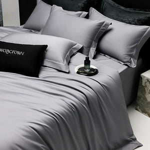 VILZSTUDIOS muted solid-color satin duvet cover set with piped borders and flanged pillowcases