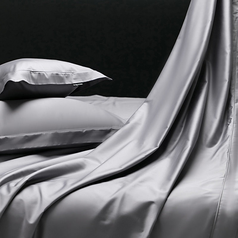 VILZSTUDIOS muted solid-color satin duvet cover set with piped borders and flanged pillowcases