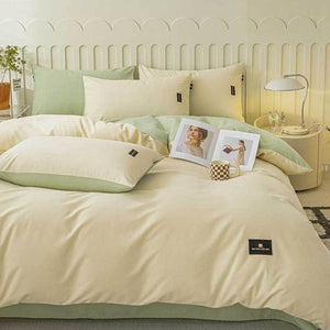VILZSTUDIOS pastel and warm neutral reversible bedding set with small rectangular woven accent patches