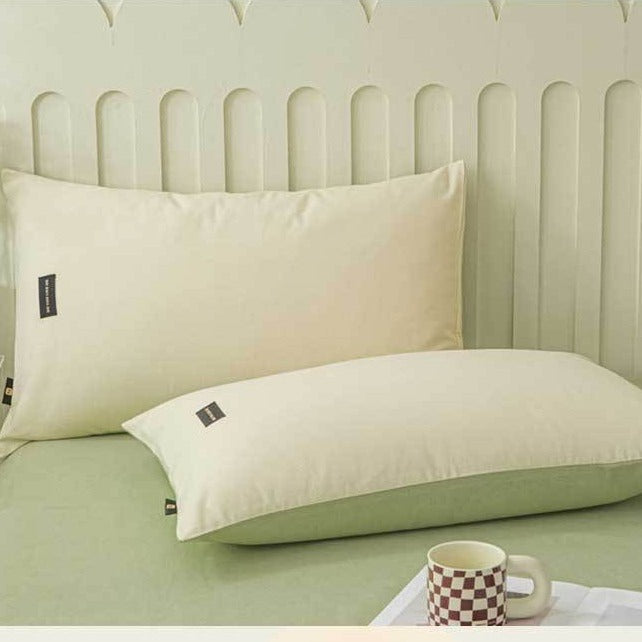 VILZSTUDIOS pastel and warm neutral reversible bedding set with small rectangular woven accent patches