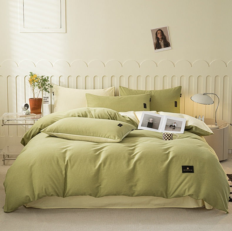 VILZSTUDIOS pastel and warm neutral reversible bedding set with small rectangular woven accent patches