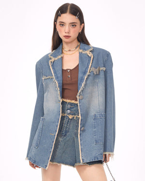 VILZSTUDIOS Ripped denim blazer with butterfly pin and frayed edges