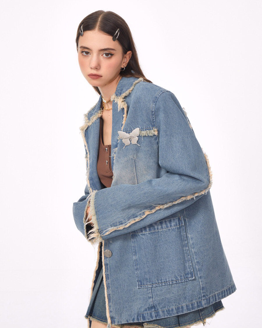 VILZSTUDIOS Ripped denim blazer with butterfly pin and frayed edges