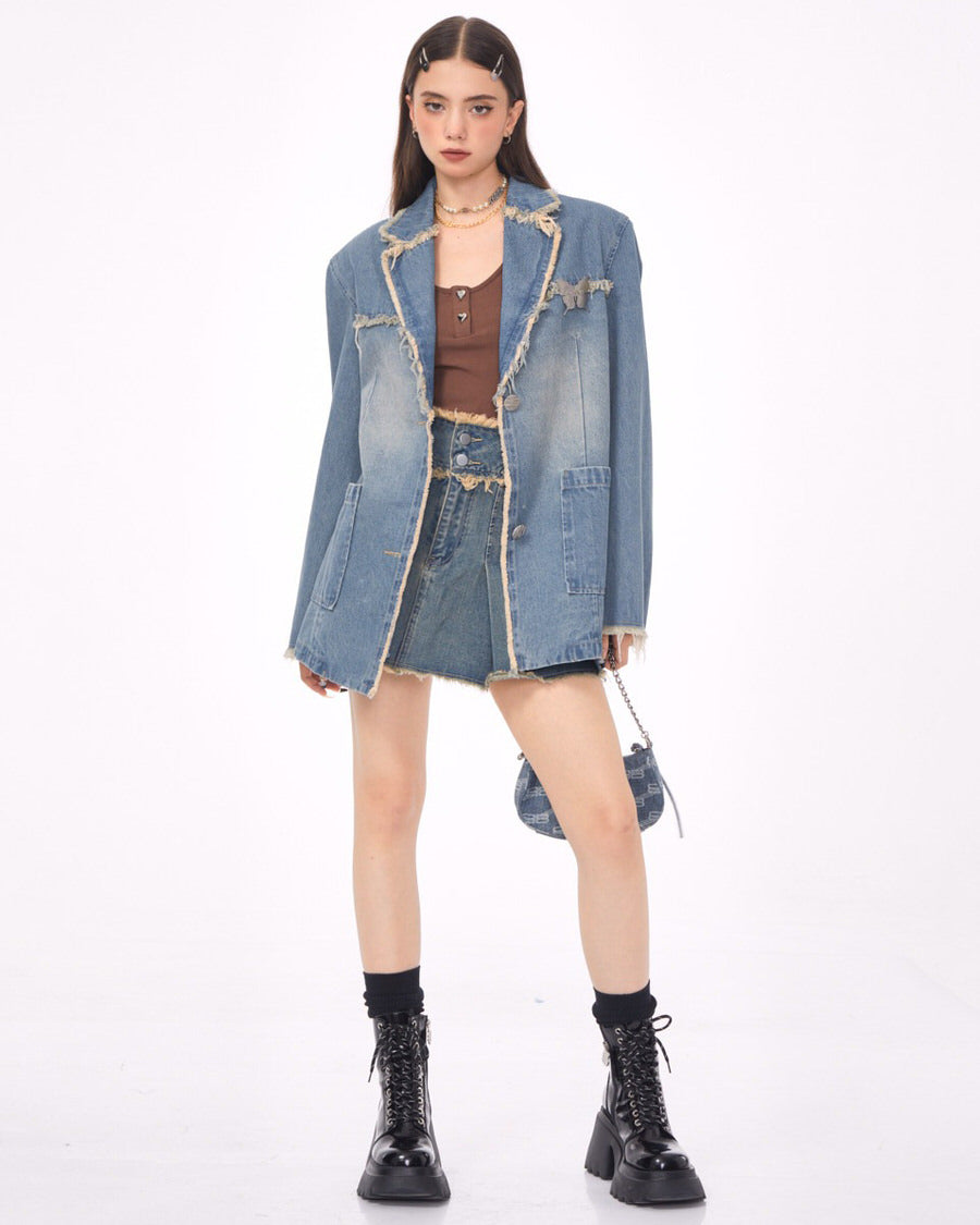 VILZSTUDIOS Ripped denim blazer with butterfly pin and frayed edges