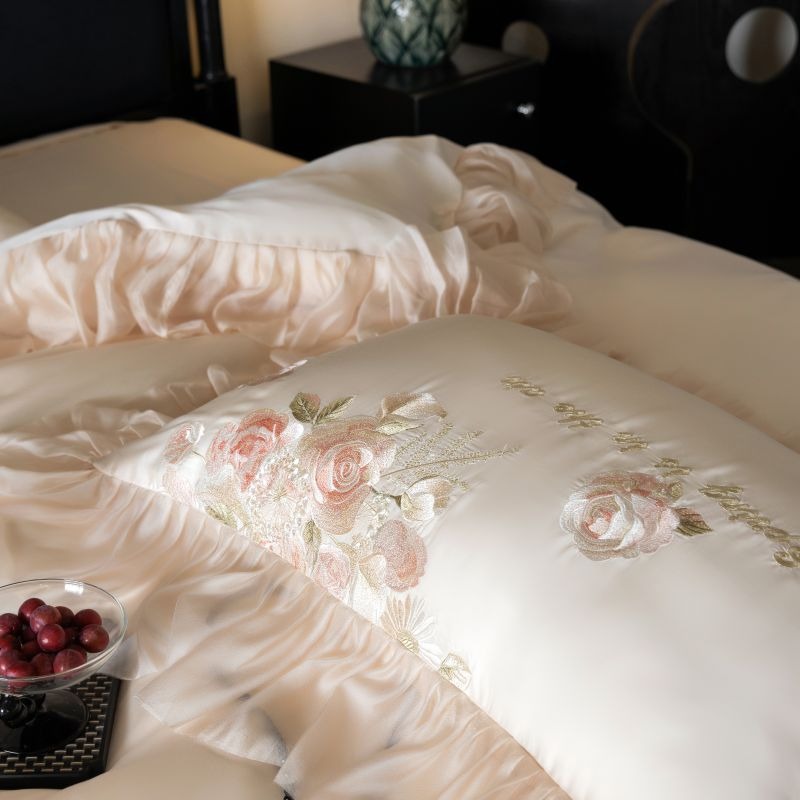 VILZSTUDIOS pale blush pink satin bedding set with rose embroidery and sheer ruffled edges