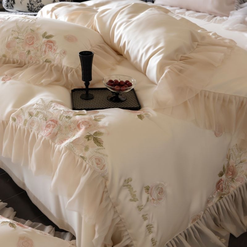 VILZSTUDIOS pale blush pink satin bedding set with rose embroidery and sheer ruffled edges