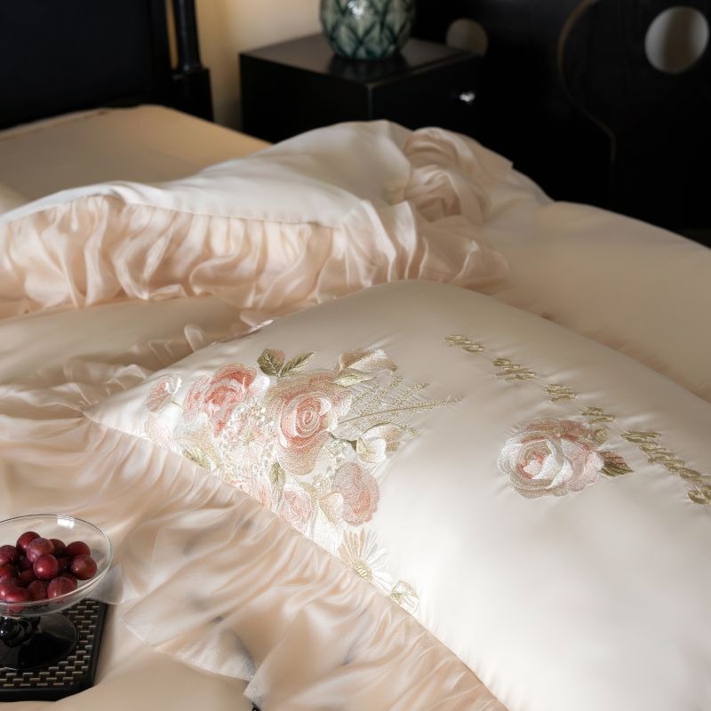 VILZSTUDIOS pale blush pink satin bedding set with rose embroidery and sheer ruffled edges