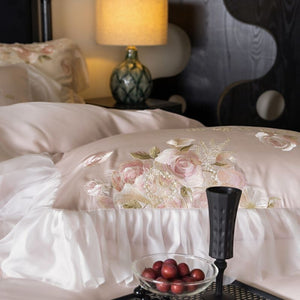 VILZSTUDIOS pale blush pink satin bedding set with rose embroidery and sheer ruffled edges