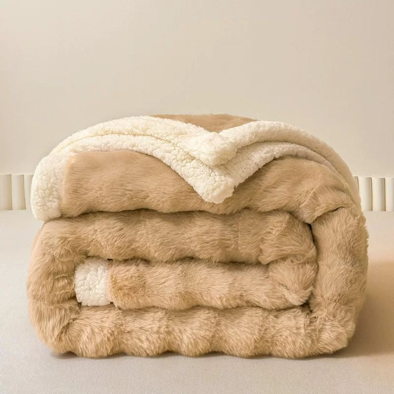 VILZSTUDIOS solid-color throw blanket with sculpted wave quilting and a cream sherpa border