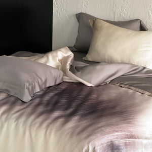 VILZSTUDIOS taupe-grey and ivory ombré satin duvet cover set with subtle ripple patterning and flanged borders