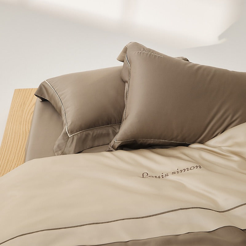 VILZSTUDIOS two-tone satin duvet cover set with script embroidery and contrast piping in taupe, mauve, rust-red or silvery gray