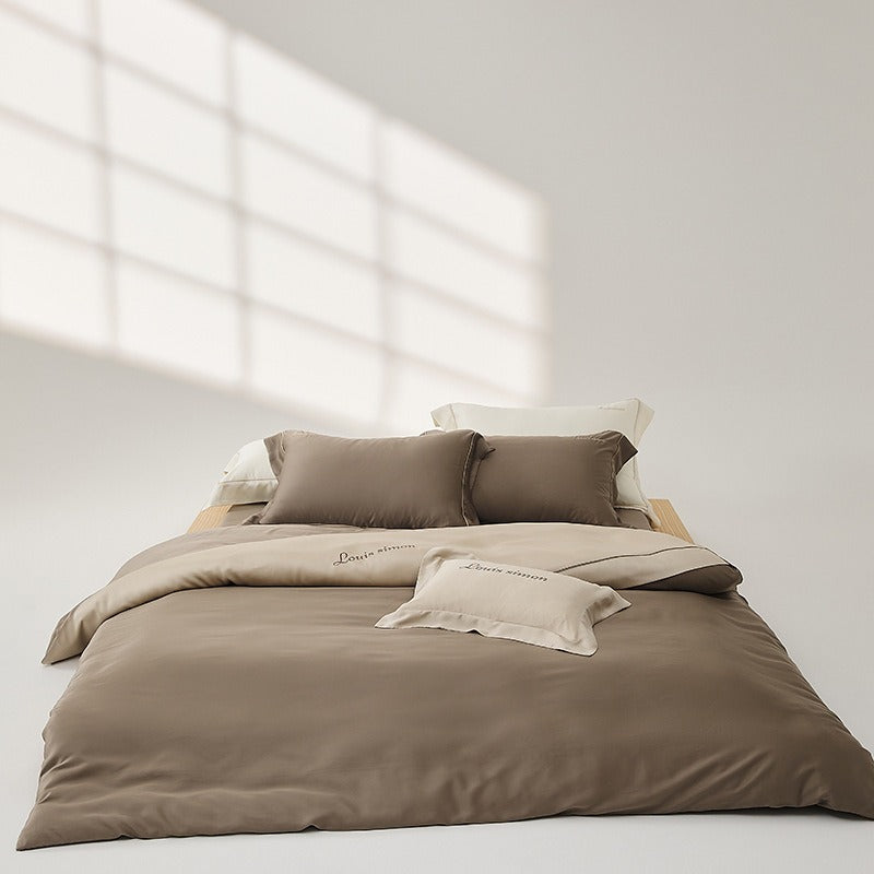 VILZSTUDIOS two-tone satin duvet cover set with script embroidery and contrast piping in taupe, mauve, rust-red or silvery gray