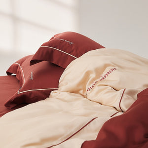 VILZSTUDIOS two-tone satin duvet cover set with script embroidery and contrast piping in taupe, mauve, rust-red or silvery gray