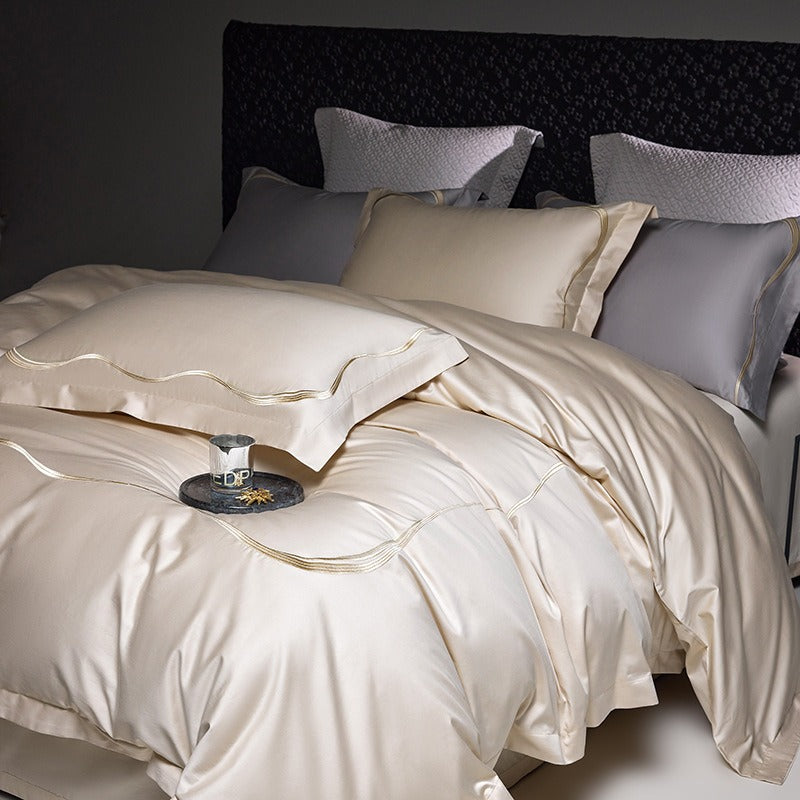 VILZSTUDIOS satin bedding set in soft colors with wavy embroidered trim and wide flanged borders