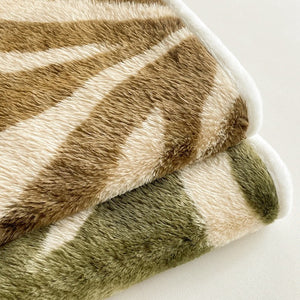 VILZSTUDIOS earth-toned zebra-stripe and mottled marble fleece fitted sheet with contrasting plush trim