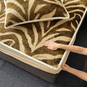 VILZSTUDIOS earth-toned zebra-stripe and mottled marble fleece fitted sheet with contrasting plush trim